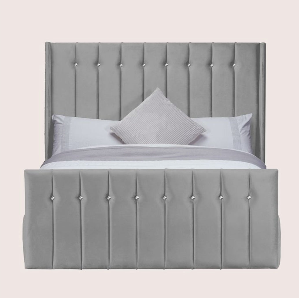 Vertical buttoned wingback bed